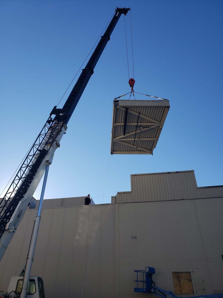 Our rigging companies in MI using a crane